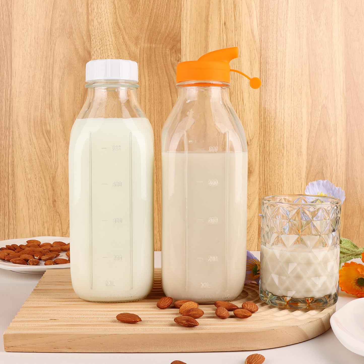 CARBLIN 32 Oz Glass Milk Bottles, 2 Pack Scale Mark Drinking Jug with 2 Nut Milk Bags& Airtight Screw Lid & Silicone Pour Cap& Stickers, 1 Quart Reusable Juice Bottle Water Pitcher for Coffee Yogurt