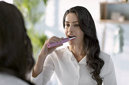 Philips Sonicare 4100 Rechargeable Electric Toothbrush, with Pressure Sensor, 2 Intensity Settings, SmarTimer and QuadPacer, 14-Day Battery Life, Deep Pink, Model HX3681/26