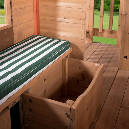 Backyard Discovery Scenic Heights Elevated Cedar Wooden Kids Playhouse with Play Kitchen, Wrap-Around Deck, Toy Storage Bench, Saloon-Style Doors, Ladder, Stairs, and Growth Chart for Outdoor Play