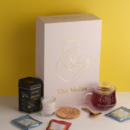 The Vedas Gift For MOM | Mothers day gift | 22 items teagift | 8 Different Flavours teabags | 1 Luxury Oolong tea tin Caddy | total 56 Cups of tea | 1 Glass Mug for MOM With lid and Infuser | 1 Scented Candle | 1 Branded Spoon | 1 Wooden Coaster