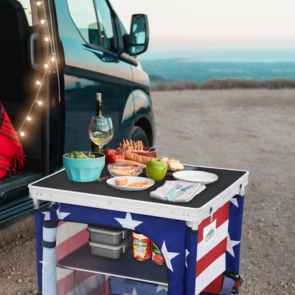EAGLE PEAK Outdoor Folding Camping Table with Large 3-Tier Storage Organizer and Side Pockets, Easy Set Up Portable Aluminum Camping Kitchen, American Flag