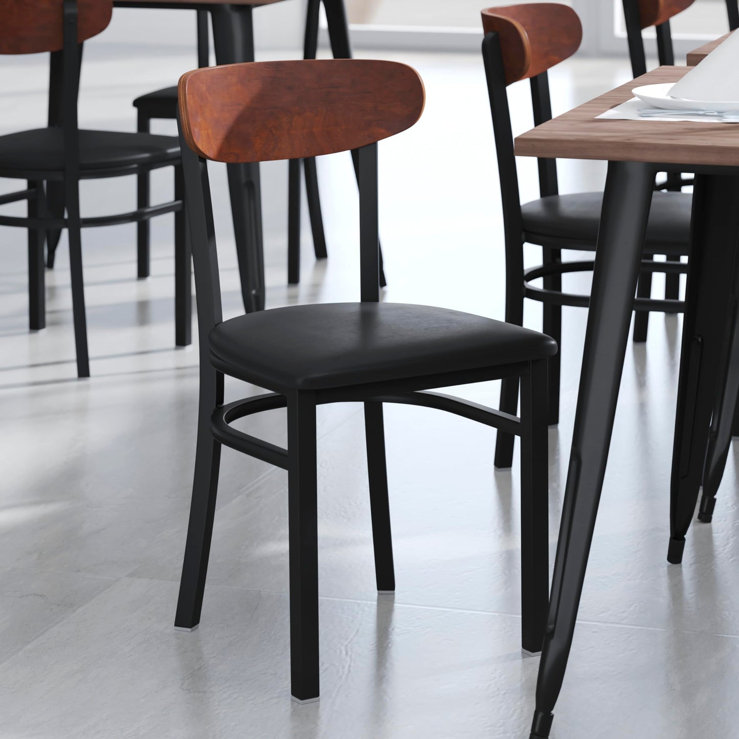 Flash Furniture Wright Set of 2 Commercial Dining Chairs - Walnut Wood Boomerang Back - Black Vinyl Seat - 500 LB. Capacity Black Steel Frame-Integrated Footrest