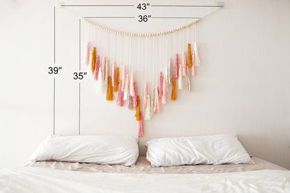 Decocove Macrame Wall Hanging - Large Macrame Wall Hanging with Wood Beads - Bohemian Wall Decor for Bedroom, Living Room and Kitchen - Pink and Gold- 35'' x 36''