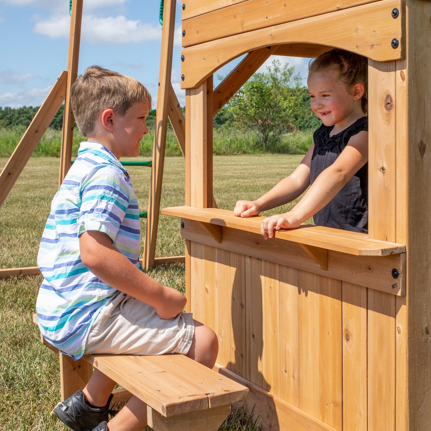 Backyard Discovery Montpelier Cedar Wood Swing Set, Wave Slide, Clubhouse, Monkey Bars, Picnic Area, Snack Bar, Belt Swings, Trapeze, Balcony, Playhouse, Working Door, Ladder, Outdoor Playset