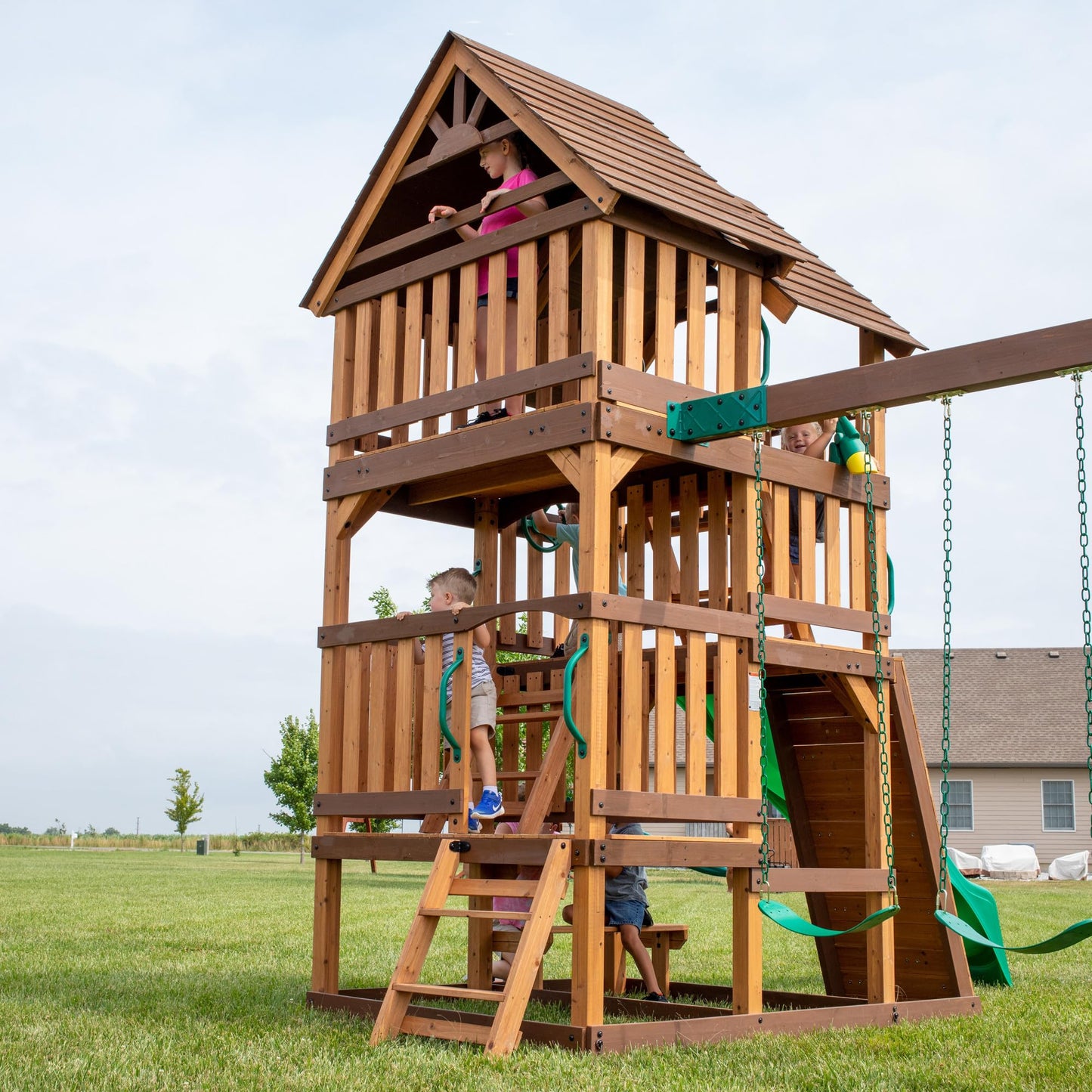 Backyard Discovery Highlander Cedar Wood Swing Set with Wave Slide, Three-Story Clubhouse, Rock Wall, Picnic Table, Belt Swings, Web Swing, Sandbox, Three Ladders, Toy Accessories, Outdoor Playset