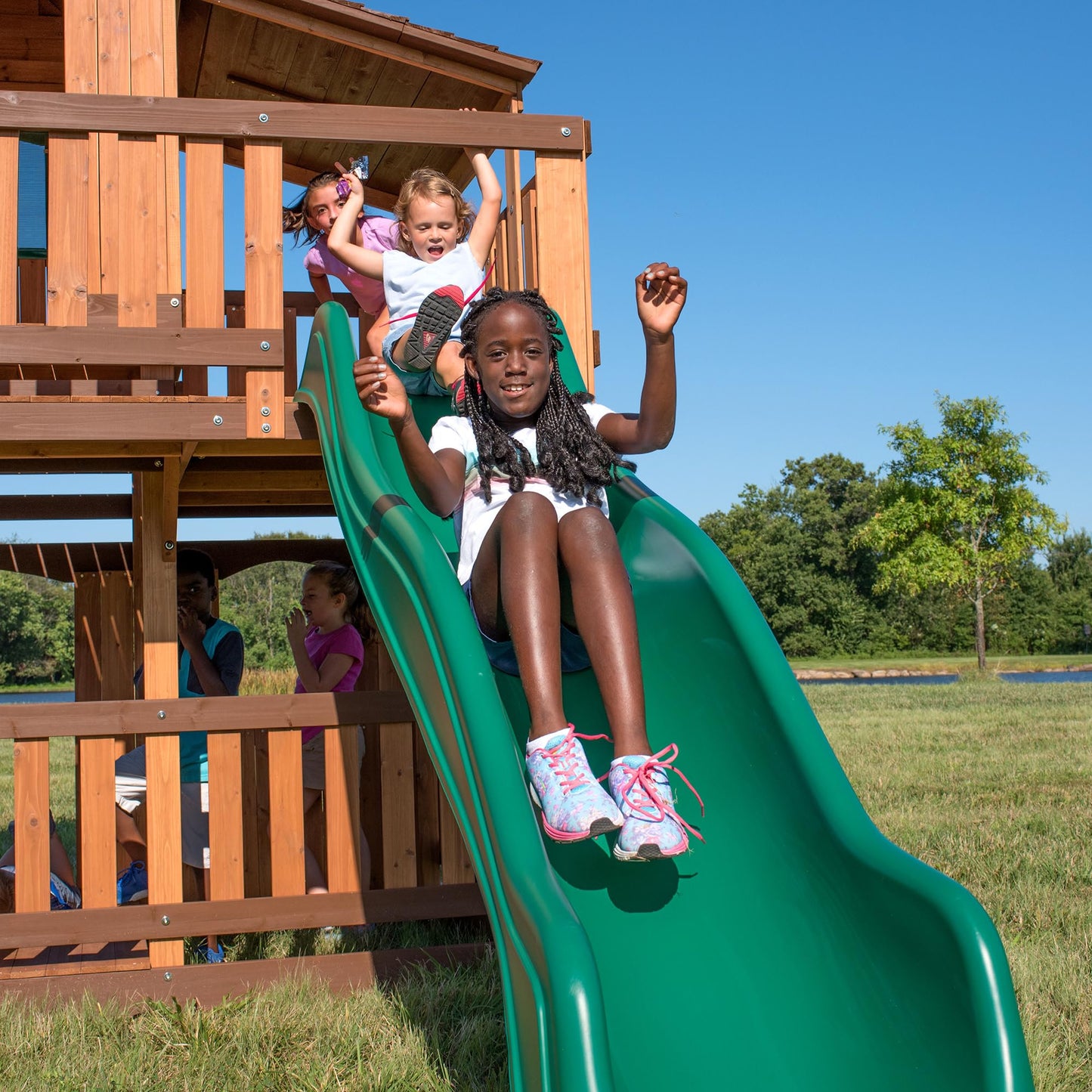 Backyard Discovery Woodridge Elite Cedar Wood Swing Set with Wave Slide, Clubhouse, Crawl Tunnel, Crow's Nest, Belt Swings, Trapeze, Rock Wall Ladder, Sandbox, Wrap-Around Porch, Deck, Outdoor Playset