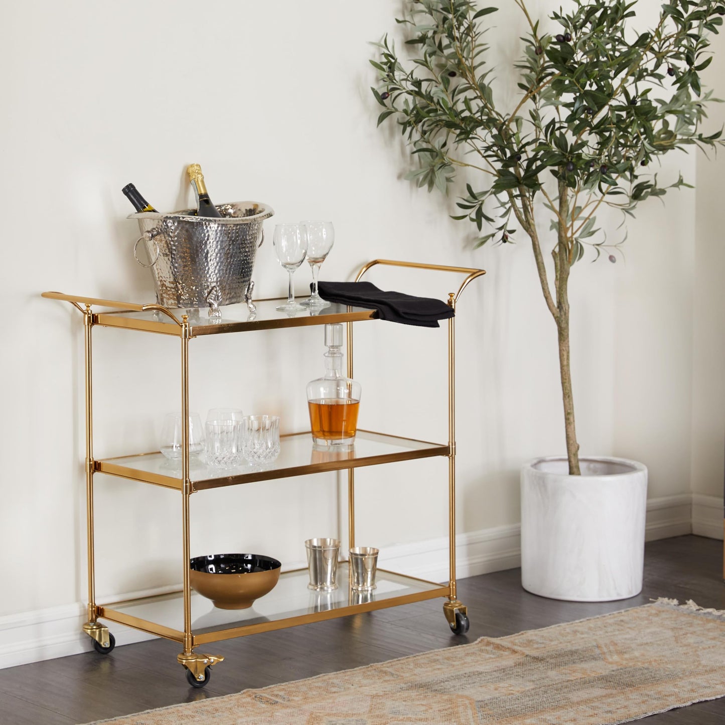 Deco 79 Metal Rolling 3 Glass Shelves Bar Cart with Lockable Wheels, 38" x 14" x 31", Brass