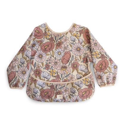 mushie Long Sleeve Baby Bib | Water Resistant Adjustable Fit for Ages 6-24 Months (Retro Flowers)