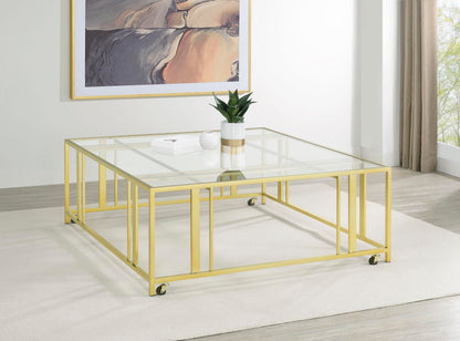 Coaster Home Furnishings - Adri - Square Glass Top Coffee Table with Geometric Base and Mobile with Rolling Casters - Contemporary - Living Room - Matte Brass - 710188