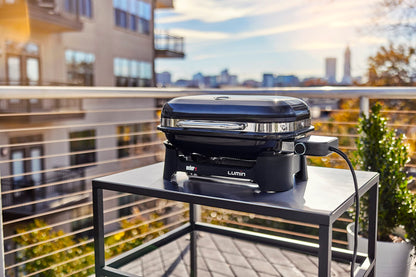 Weber Lumin Portable Electric Grill, Black – High‑Heat Outdoor BBQ Reaching 600°F for Searing, Smoking, Steaming & Warming – Ideal for Samll Spaces & Travel
