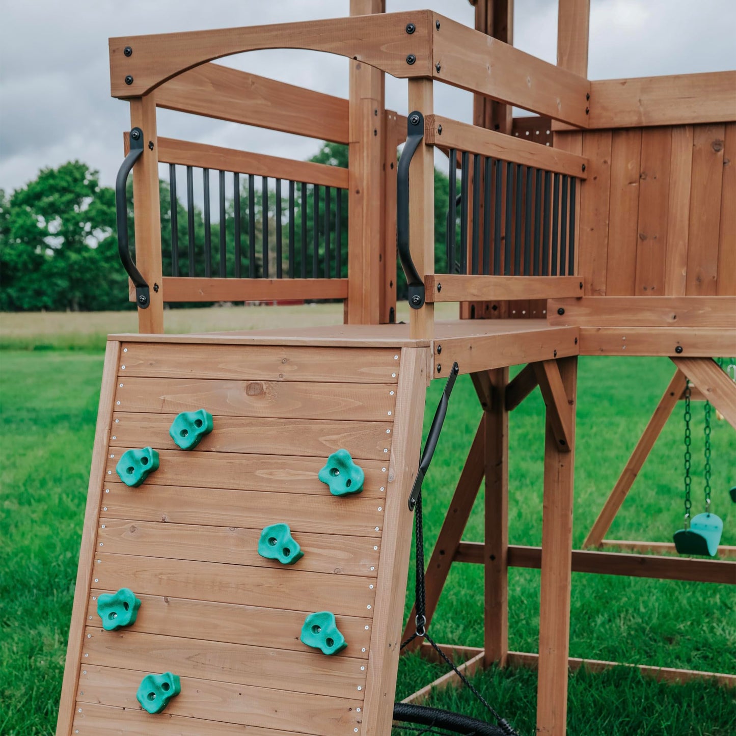 Backyard Discovery Sterling Point Cedar Wood Swing Set with Wave Slide, Raised Clubhouse, Wooden Bridge, Rock Wall, Belt Swings, Web Swing, Trapeze, Balcony, Climbing Wall, Ladder, Outdoor Playset
