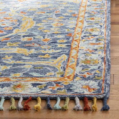 SAFAVIEH Aspen Collection Area Rug - 9' x 12', Blue & Rust, Handmade Boho Braided Tassel Wool, Ideal for High Traffic Areas in Living Room, Bedroom (APN116M)