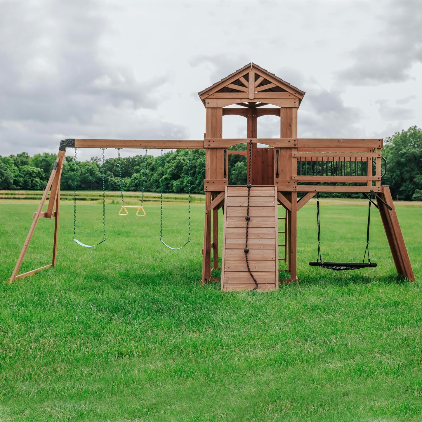 Backyard Discovery Sterling Point Cedar Wood Swing Set with Wave Slide, Raised Clubhouse, Wooden Bridge, Rock Wall, Belt Swings, Web Swing, Trapeze, Balcony, Climbing Wall, Ladder, Outdoor Playset
