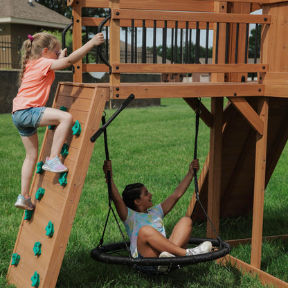 Backyard Discovery Sterling Point Cedar Wood Swing Set with Wave Slide, Raised Clubhouse, Wooden Bridge, Rock Wall, Belt Swings, Web Swing, Trapeze, Balcony, Climbing Wall, Ladder, Outdoor Playset
