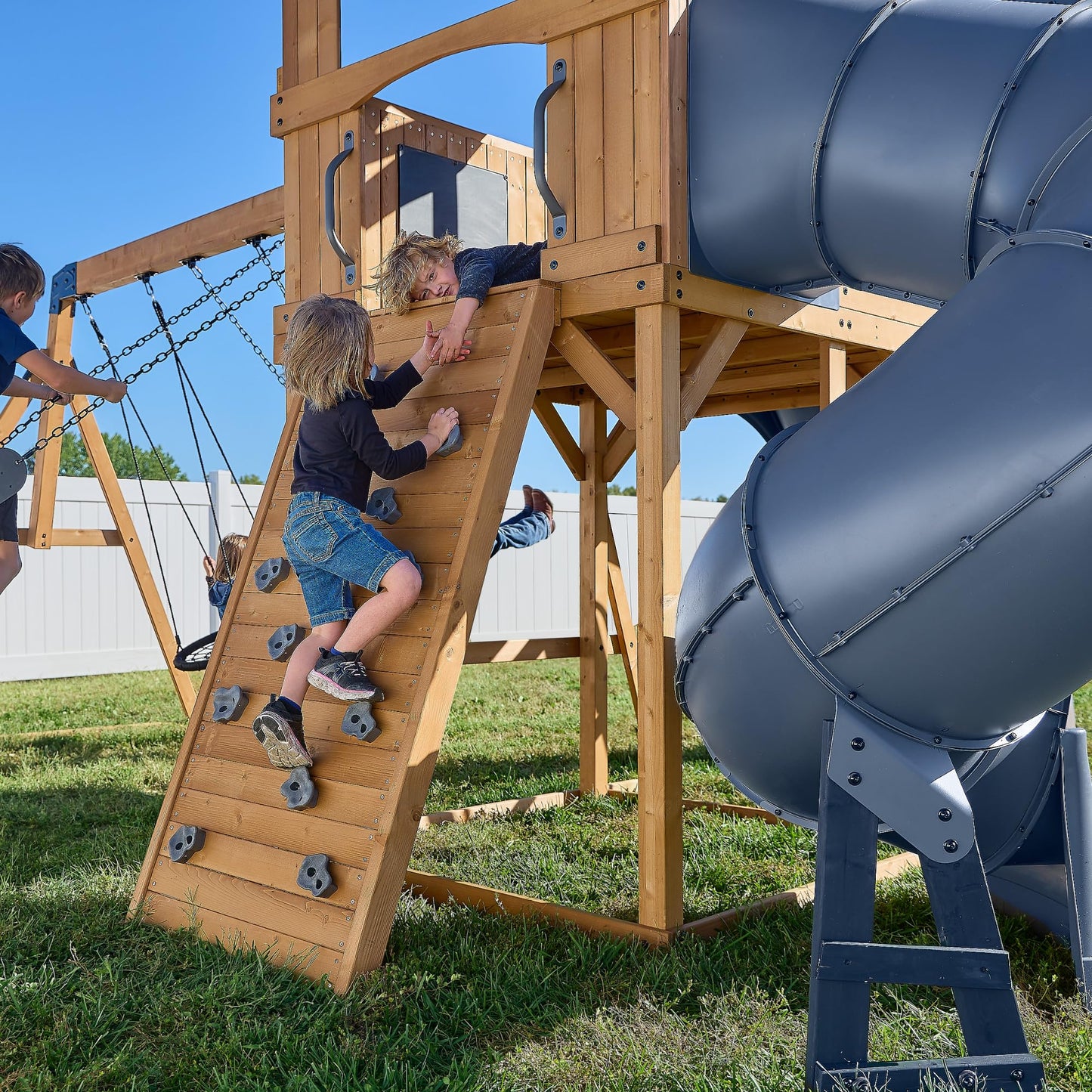 Backyard Discovery Dover Bay Spruce Wood Swing Set with Spiral Tube Slide, Wave Slide, Clubhouse, Rock Wall, Belt Swings, Step Ladder, Toy Telescope, Chalkboard, Outdoor Playset