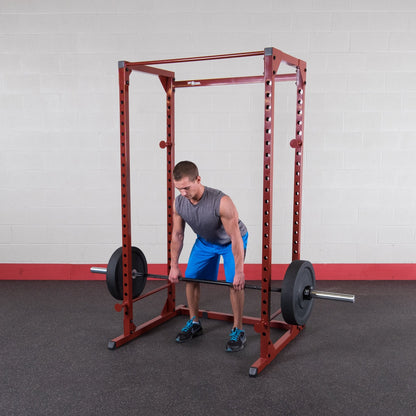 Body-Solid Best Fitness Power Rack - 14-Gauge Steel Home Gym with 500lb Capacity, Chin Bar, 23 Adjustable Safety Bars, Optional LAT & Dip Attachments, Red