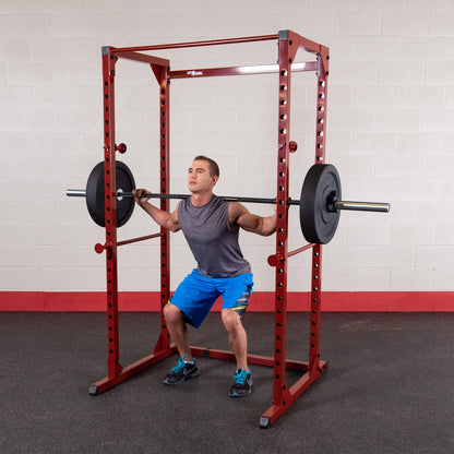 Body-Solid Best Fitness Power Rack - 14-Gauge Steel Home Gym with 500lb Capacity, Chin Bar, 23 Adjustable Safety Bars, Optional LAT & Dip Attachments, Red